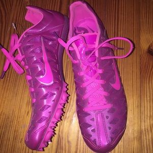 Pink Nike running track spikes